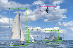 Green rectangles around boats and pink rectangle around airplane